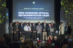 New Horizons imaging and spectroscopy team accepts the SPIE George W. Goddard Award